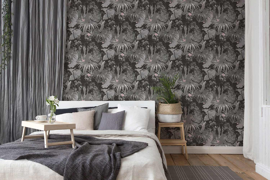 Bedroom with floral patterned wallpaper and wooden furniture