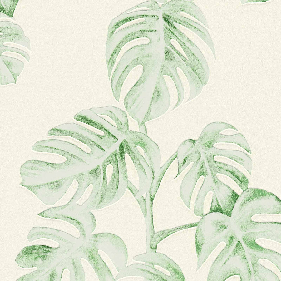 Pattern of green leaves on a light cream background